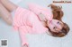 a woman laying on top of a white rug