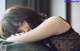 A little girl laying on top of a couch with her head on her hands.